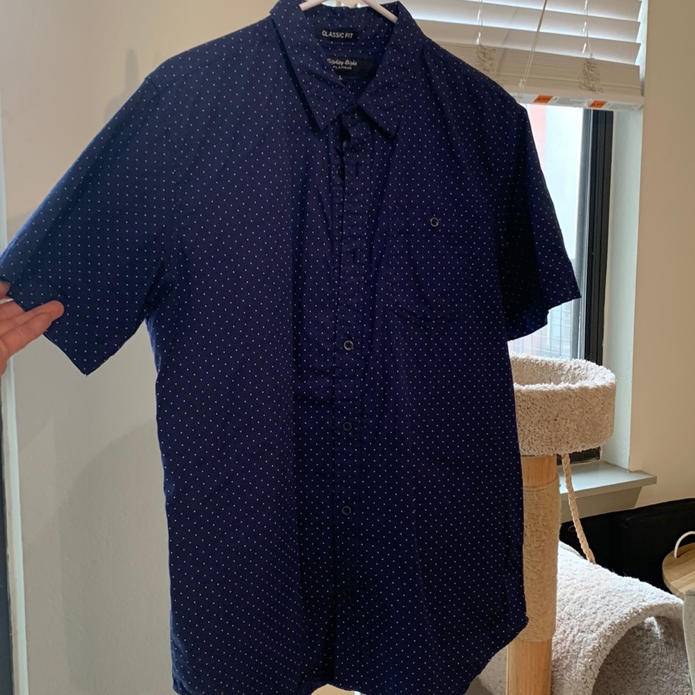 Dark blue, polka dotted casual button down shirt.